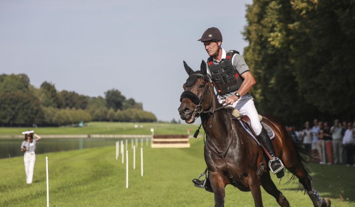 Horses gallop in Versailles Palace gardens to test the track for the Paris Olympics