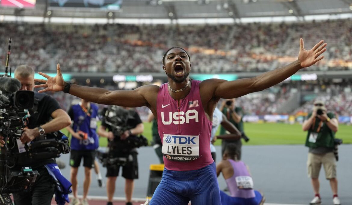 Noah Lyles breaks into tears on medal stand after receiving gold medal for 100-meter win at worlds