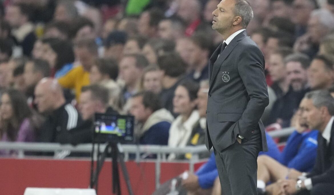 Ajax and Feyenoord's Eredivise match halted as fans throw fireworks on the field