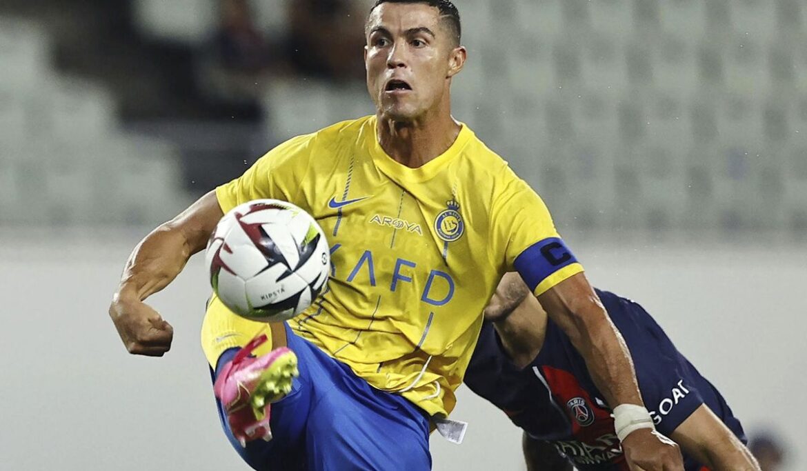 Iranian soccer fans flock to Cristiano Ronaldo's hotel after he arrives in Tehran with Saudi team