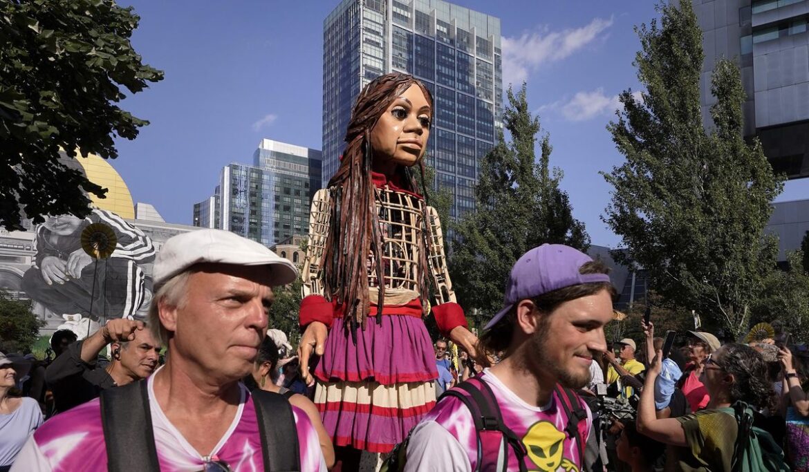Little Amal, a 12-foot puppet of a Syrian refugee, began its journey across the US in Boston