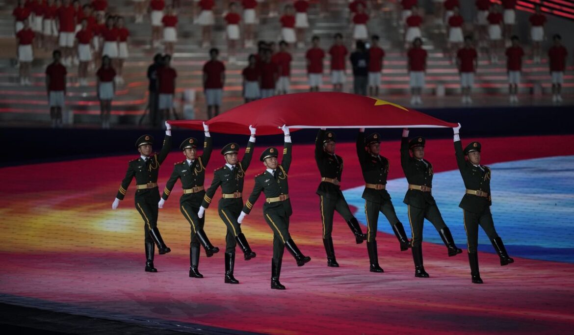 Lots of dignitaries but no real fireworks - only electronic flash - as the Asian Games open