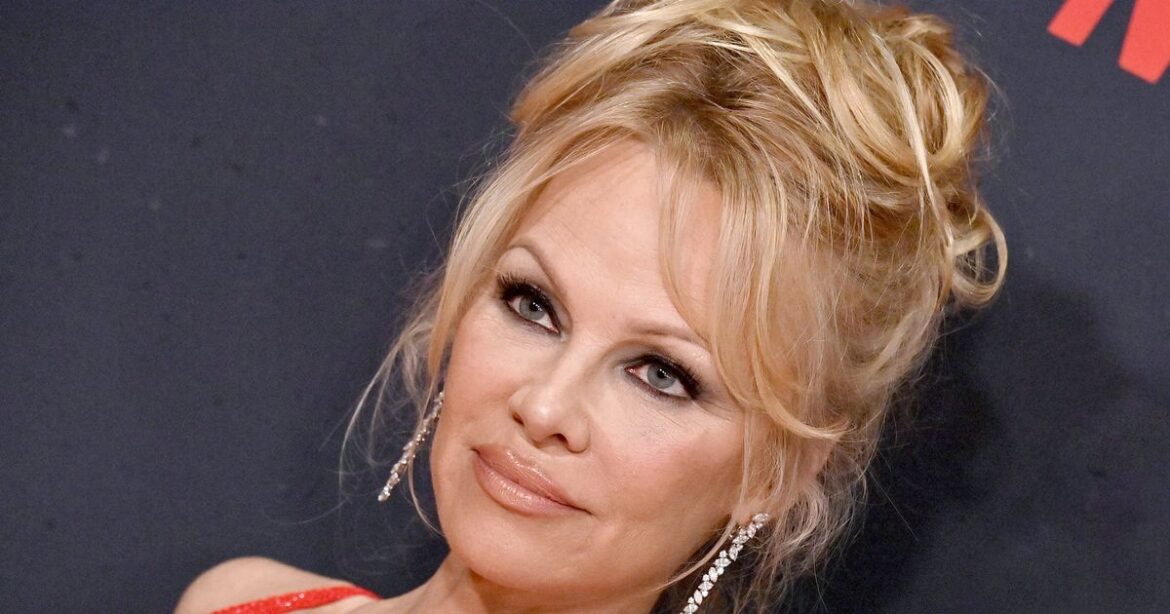Makeup-Free Pamela Anderson Shines At Paris Fashion Week
