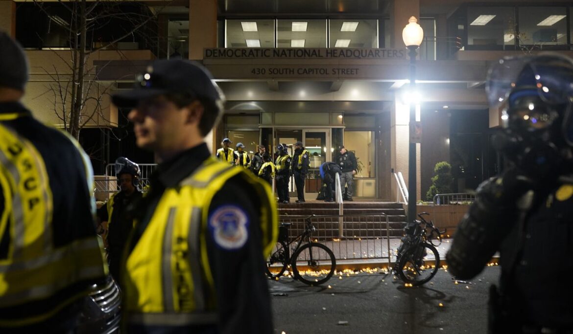 Anti-war demonstrators clash with police at DNC headquarters in Washington, D.C.