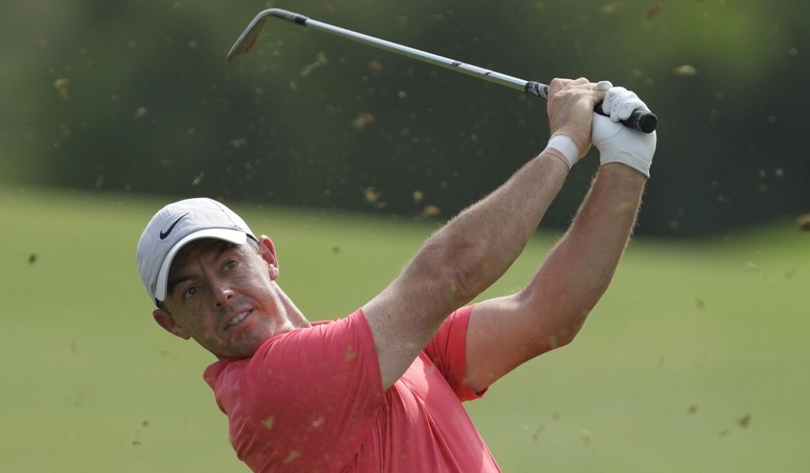 Awkward lie: Rory McIlroy's ball falls in the lap of a spectator at World Tour Championship