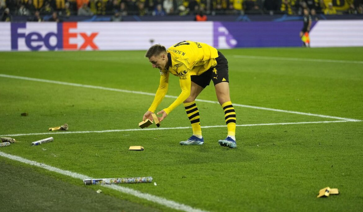 Borussia Dortmund fans throw fake money to protest UEFA's planned Champions League reforms
