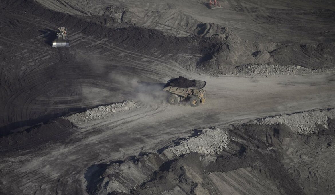 Canada says it can fight climate change and be major oil nation. Massive fires may force a reckoning