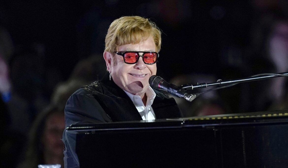 Elton John addresses Britain's Parliament, urging lawmakers to do more to fight HIV/AIDS