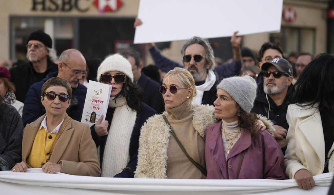 French performers lead a silent Paris march for peace between Israelis and Palestinians