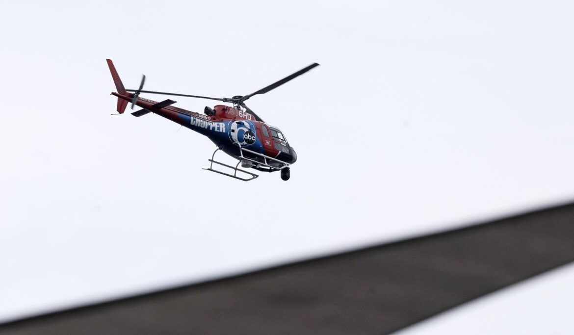 Doomed Philadelphia news helicopter hit trees fast, broke up, then burned, killing 2 on board