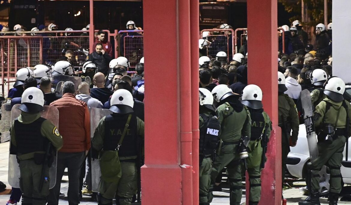 Top-level soccer matches in Greece postponed after serious clashes injure police officer