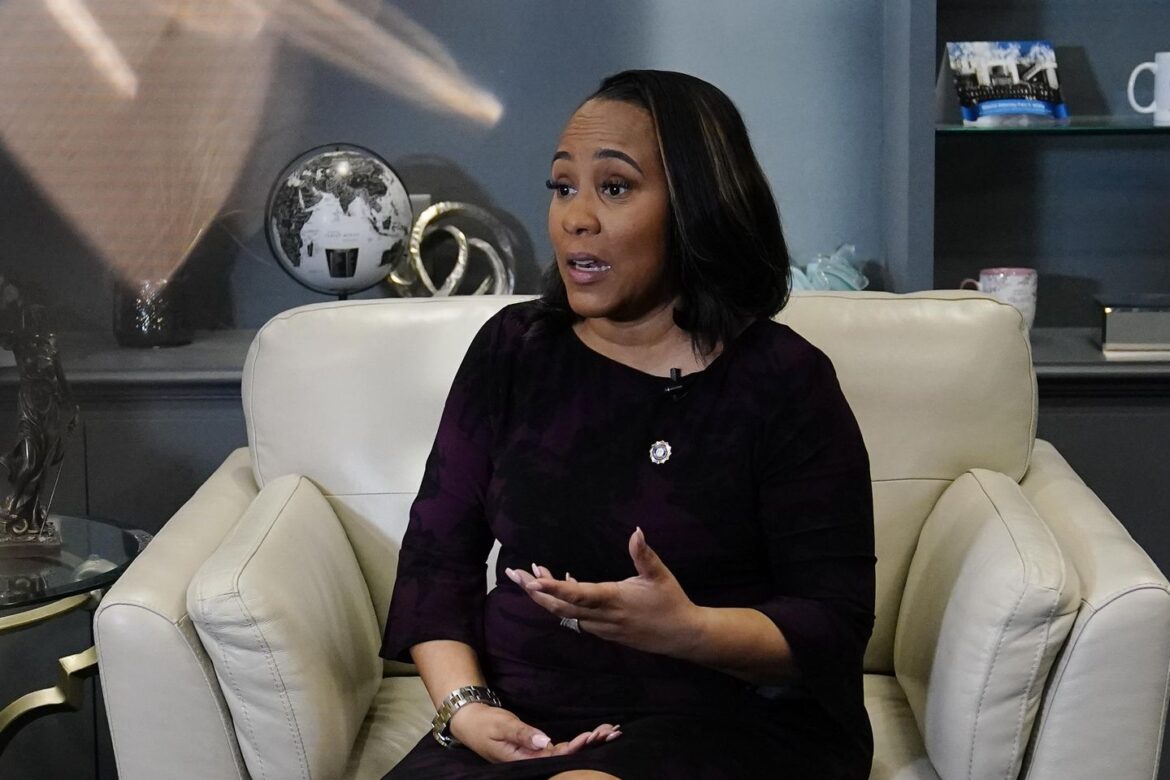 Georgia DA admits relationship with prosecutor but fights to stay on Trump case