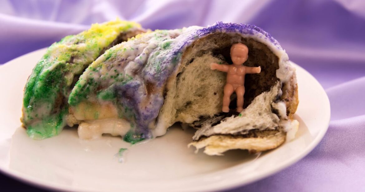 Here's Why There's A Plastic Baby Jesus Hiding Inside Your King Cake